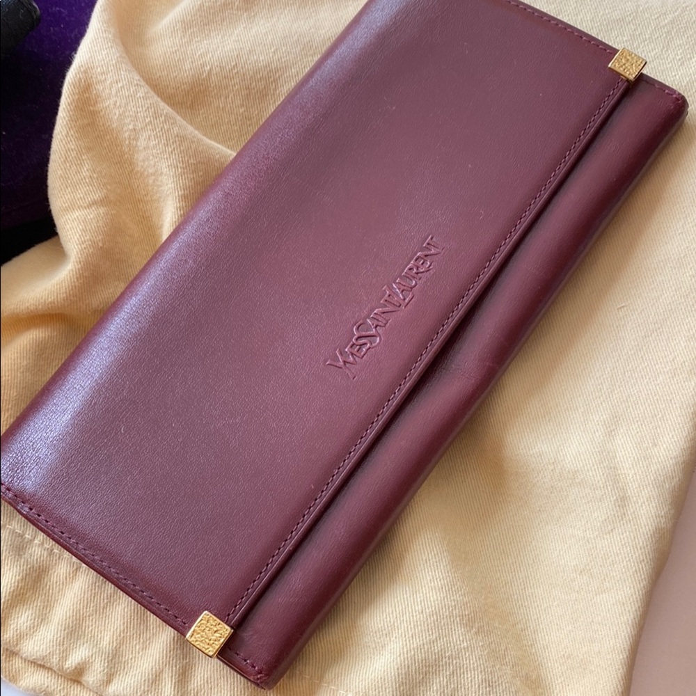 Yves Saint Laurent Plum Leather Wallet with Gold Details.